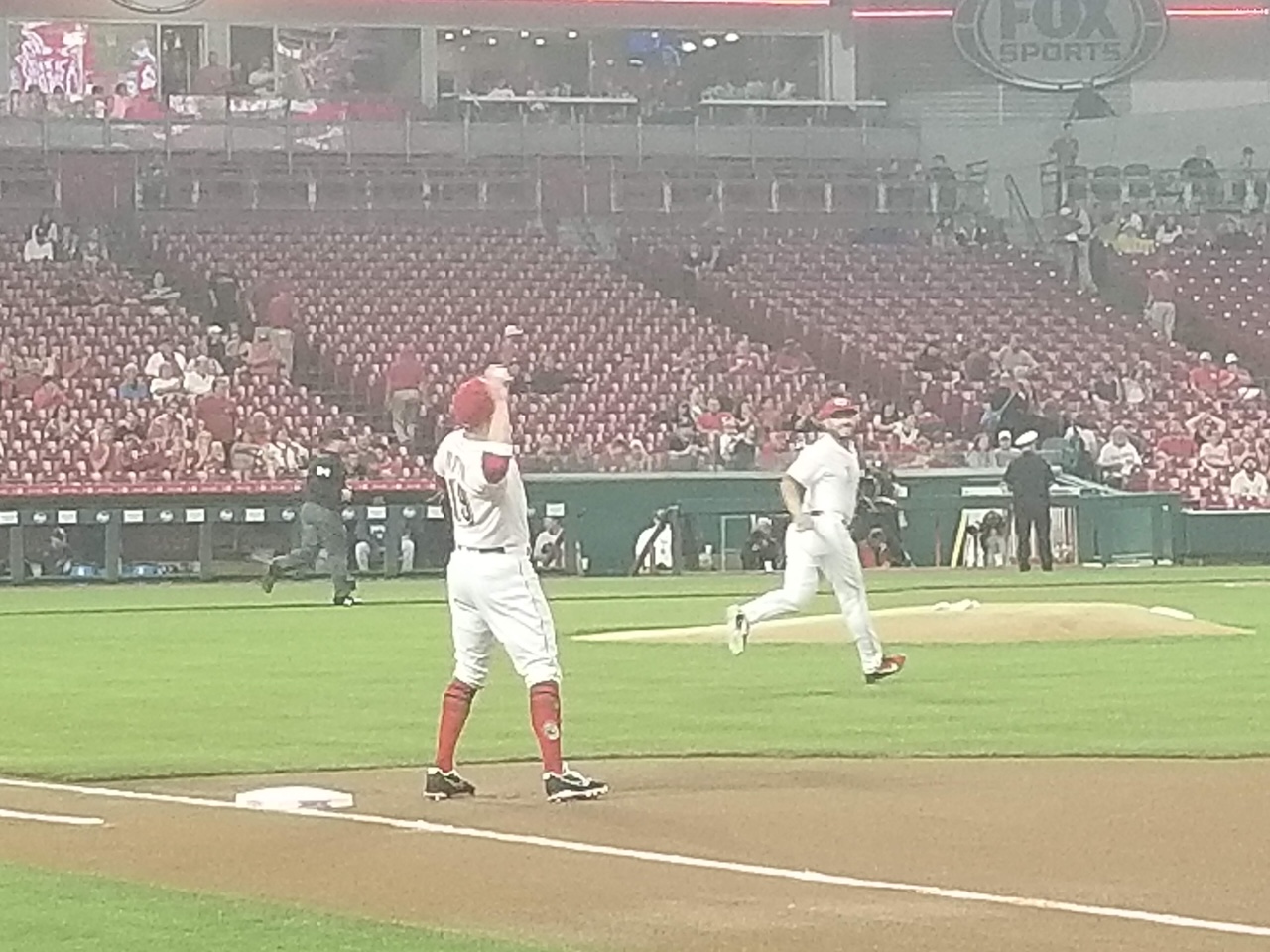 Joey Votto gets loose on a misty evening at the Great American Ball Park—rumors swirl about a future in Chicago. Could he be a Cub soon?